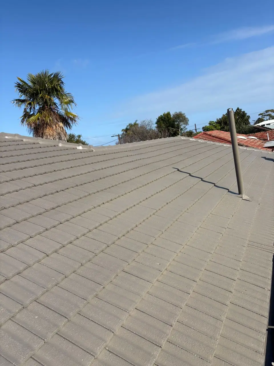Tile roof around a flue penetration